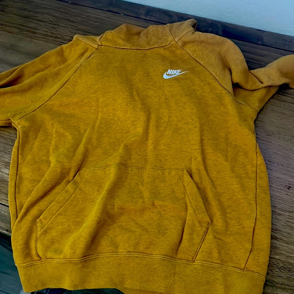 this is a yellow nike hoodie still in good condition